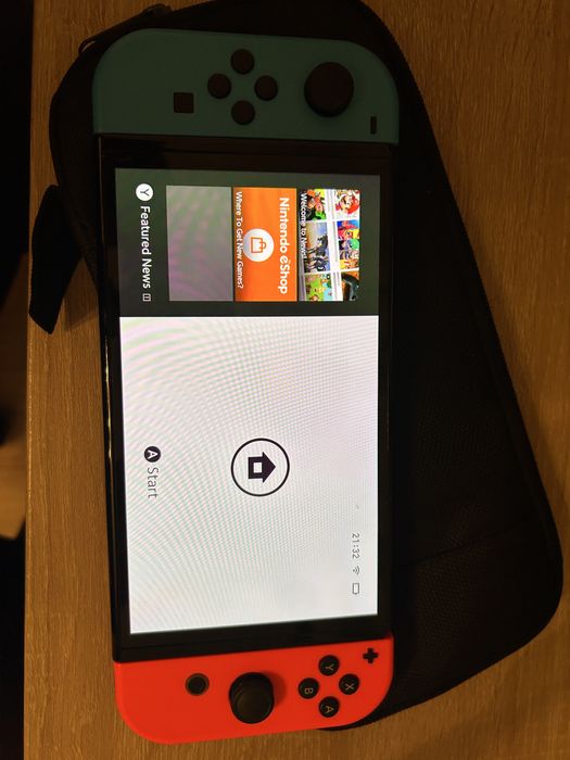 Nintendo Switch OLED (Red/Blue) + Joc FIFA 23 + Husă & Accesorii