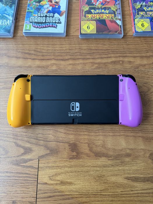 Nintendo Switch OLED + 9 jocuri + accesorii