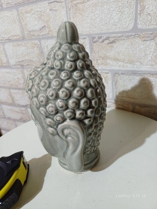 Порцеланова статуетка будиски божества