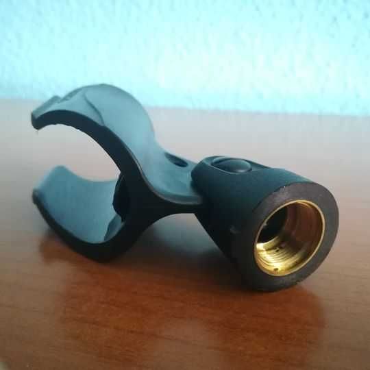 Suport nuca clema SHURE pentru microfon , realizat din ABS rezistent.