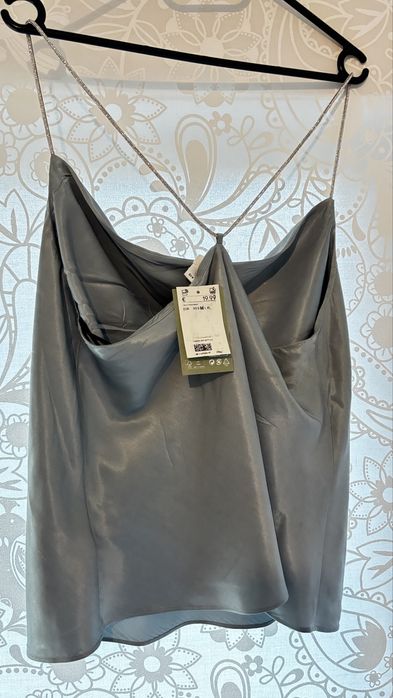 Светло син потник с блестящи презрамки