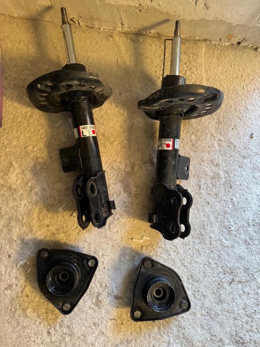Амортизаторы передние и опорные чашки