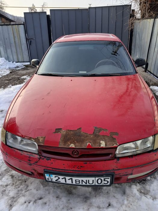 Мазда Кронс 626.