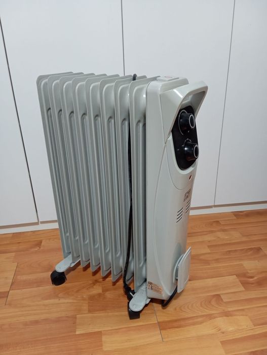 Calorifer electric cu ulei Star-Light YOH9  2000 W  9 elementi 145 x 582 mm, 5 canale ulei, 3 trepte de putere, Termostat reglabil, Indicator luminos