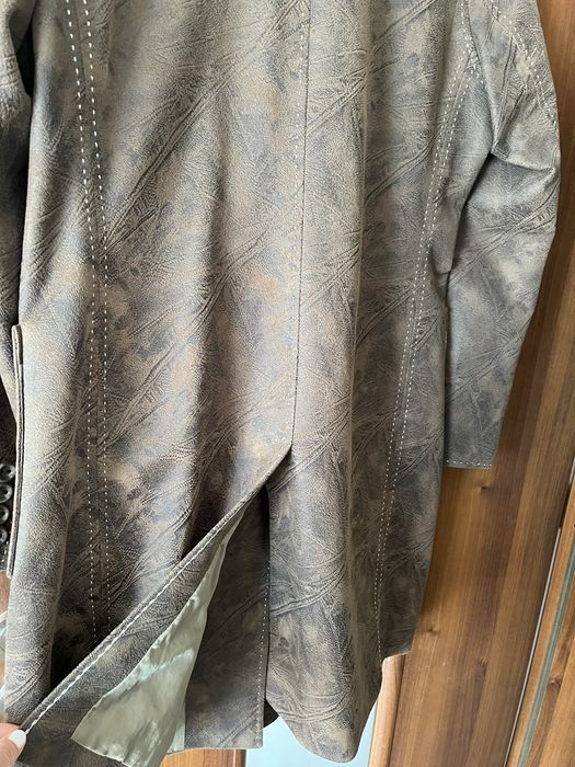 Връхно дамско палто,удобно и практично.