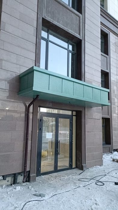Облицовка здания фасадные работы.