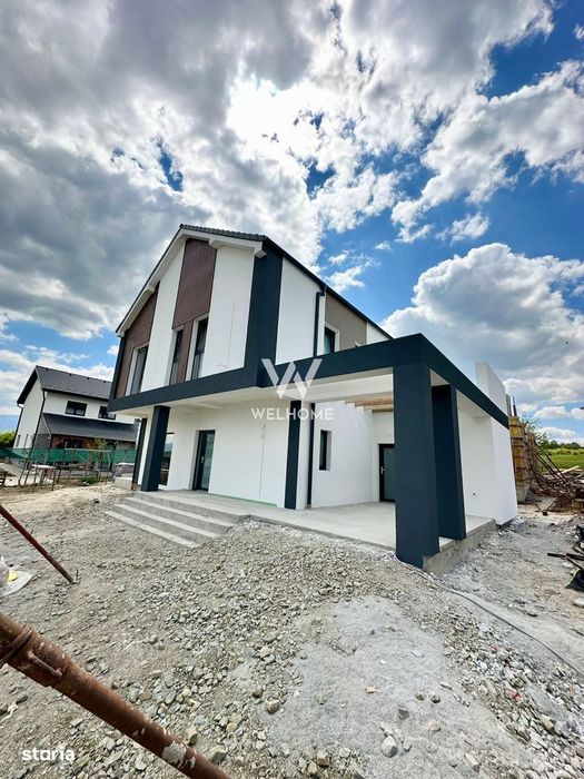 Casă single modernă, eficientă energetic și curte generoasă