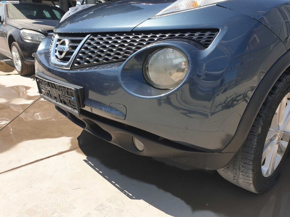 Bara Spoiler Fata cu Proiectoare FARA Grila cu Emblema Nissan Juke F15 NFL Non Facelift 2010 - 2014 Culoare RAQ [K6302]