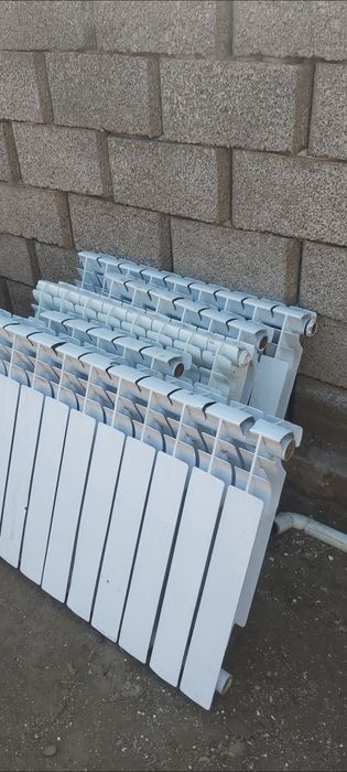 Продается чугунные и алюминиевые батареи,радиаторы