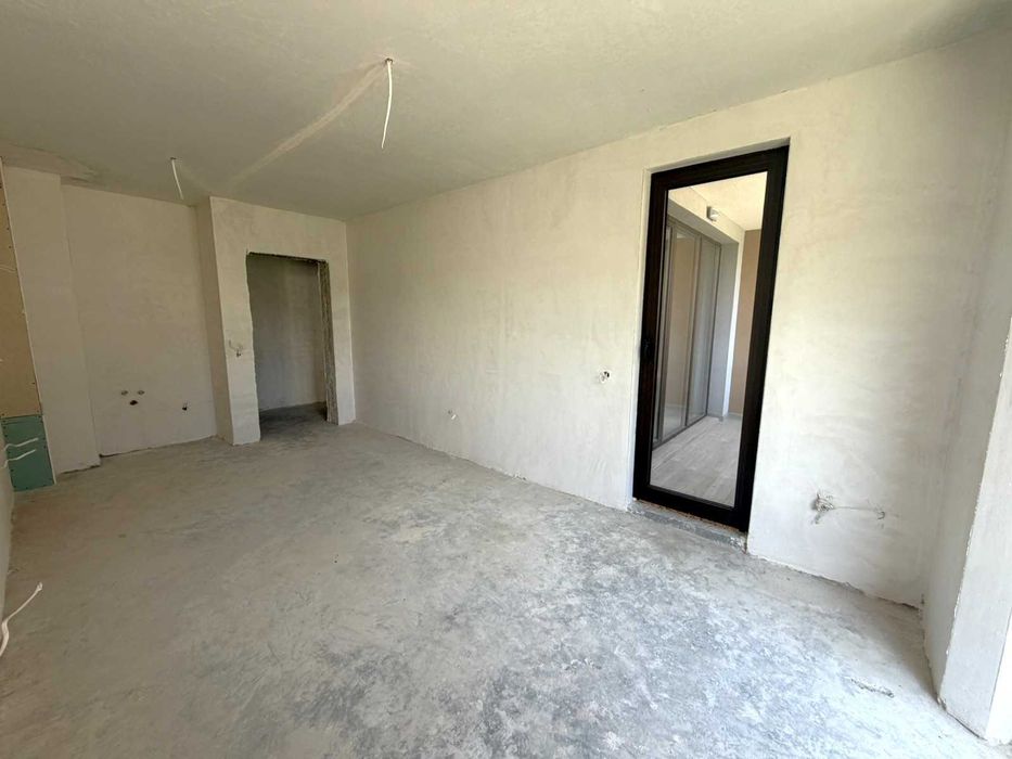 Необзаведен двустаен апартамент за продажба в затворен комплекс Pirin Castle Residence в Банско