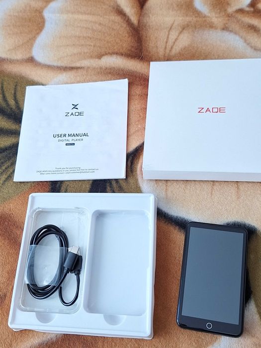 Media player portabil ZAQE -defect-  (modelul ZAQE M505), un dispozitiv MP3/MP4/media player cu ecran tactil și Bluetooth