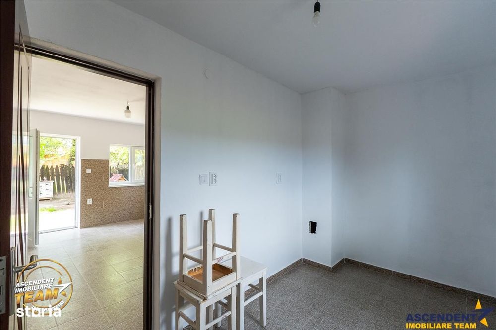 1.200mp teren si casa cu gradina inflorata, aproape de Targu Secuiesc: