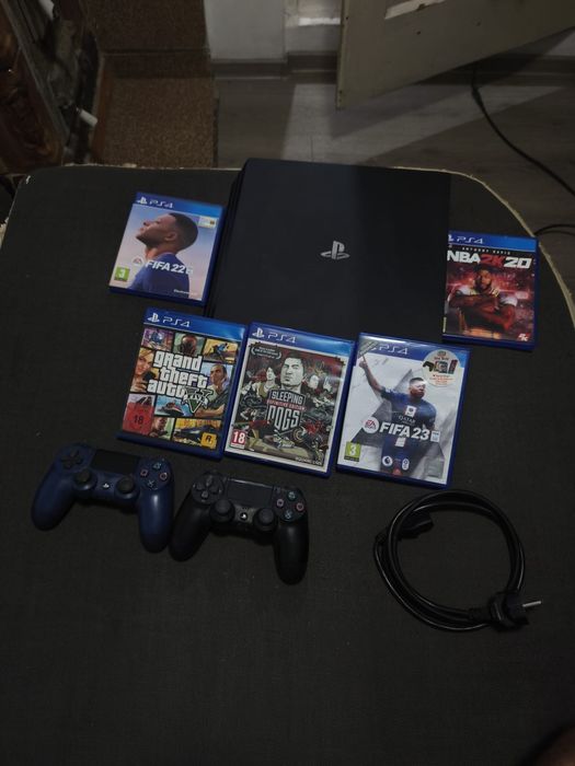 PS4 PRO 1TB + 2 manete + 6 jocuri – pachet complet