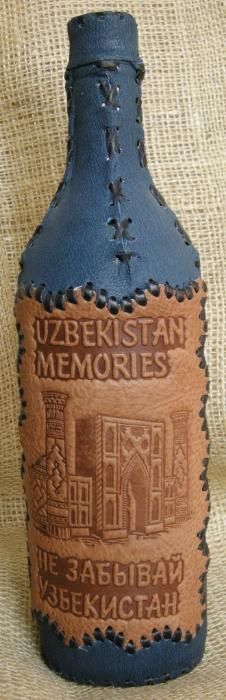 Бутылки сувенирные декорированные кожей.