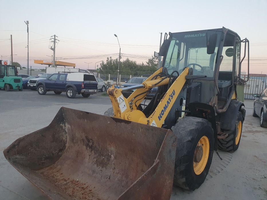 Vola, minivola Komatsu WA70, incarcator frontal,  cupa / furci