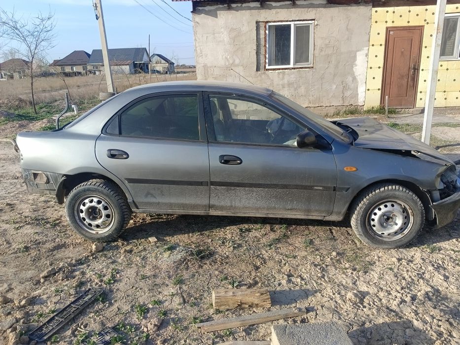 Мазда 323      200 000тг