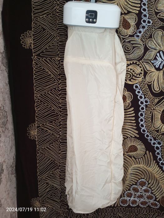 Kiyimni quritib hamda dazmollab beradigan apparat xitoyniki