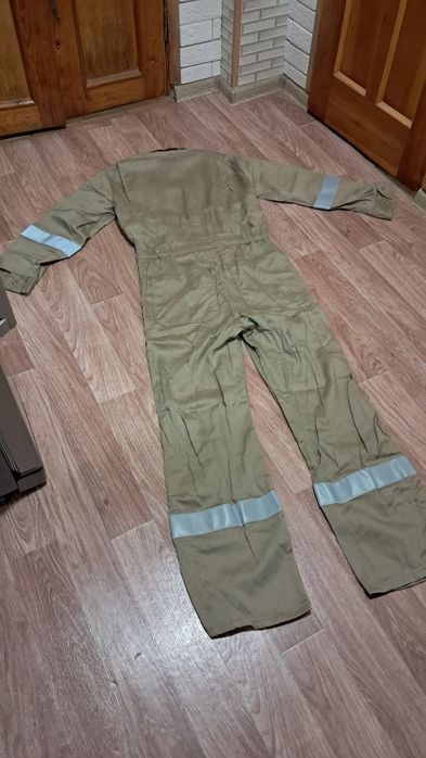Продам новый фирменный комбинезон!