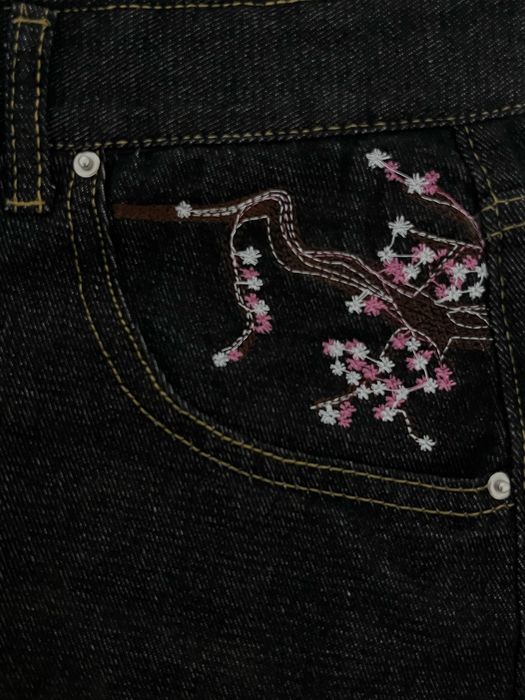 джинсы с сакурой
