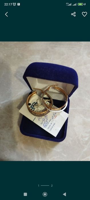 Продам золотые серьги