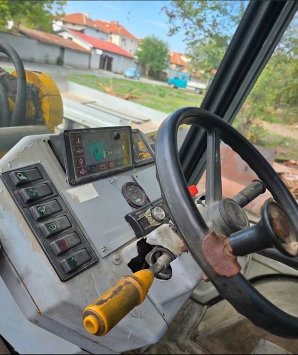 Телескопичен челен товарач