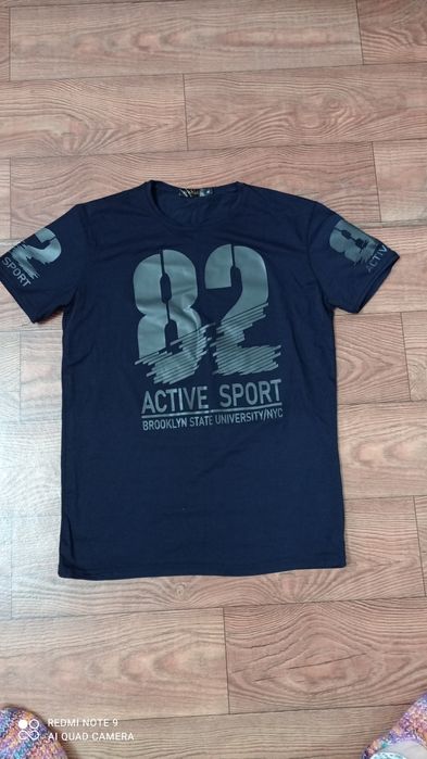 Новая футболка 50 размер