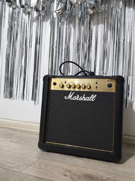 Продам комбоусилитель Marshall MG15G черный
