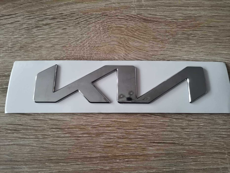 Лого Kia сребрист гланц 21см