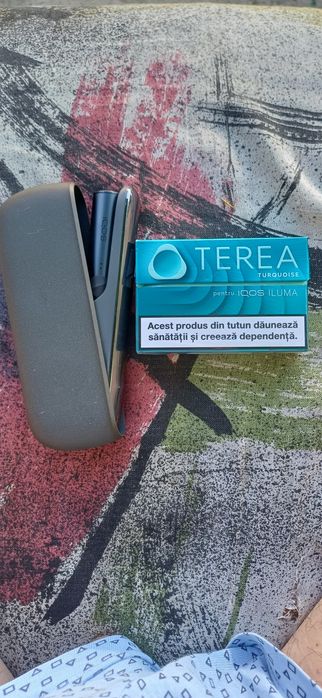 Tigară electronică gama IQOS ILUMA care folosește TEREA).