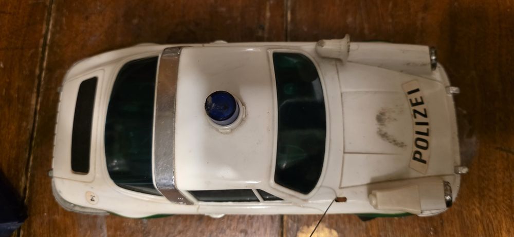 Mașinuța Polizei Porsche alb-verde cu radiocomanda  1974
