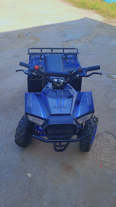 ATV pe benzina pentru copii, maxim 65 kg, motor 49cc, 35 km/h suspensii 2 frane  scaun piele  albastru