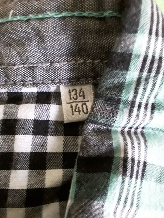 Риза 134-140 см.