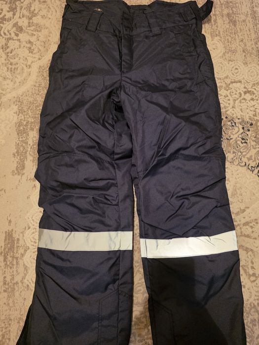 Продам зимний комбинезон новый.