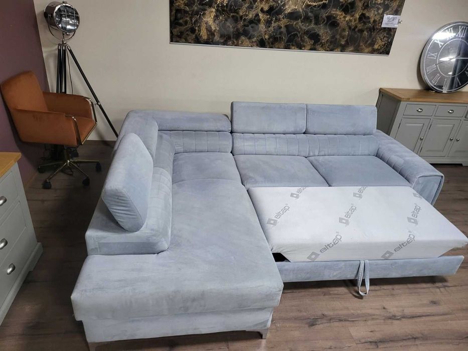 ПРОМОЦИЯ! Светло син ъглов диван от плат с функция сън и ракла