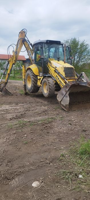 Execut lucrări de săpătură buldoexcavator new Holland lb95b