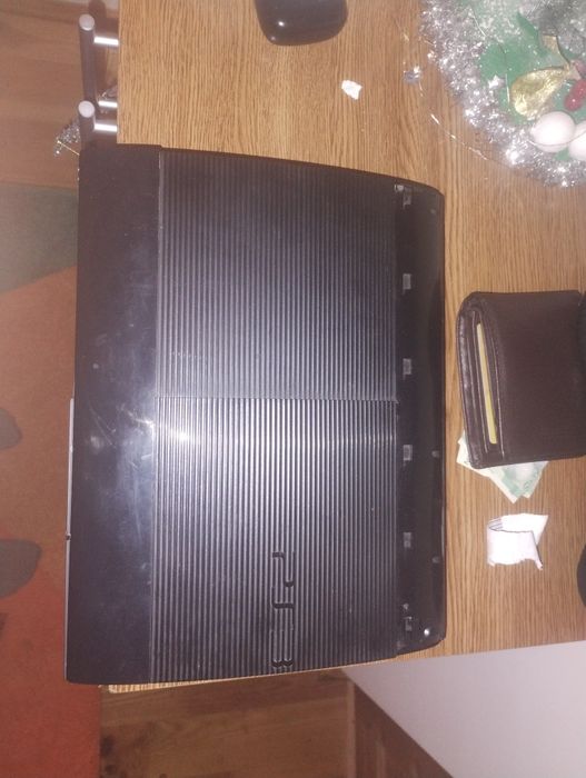 PlayStation 3 Superslim 500 GB MODAT HEN 4.92+32 de jocuri+2controlere