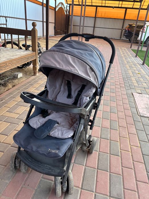 Продам прогулочную коляску Tomix