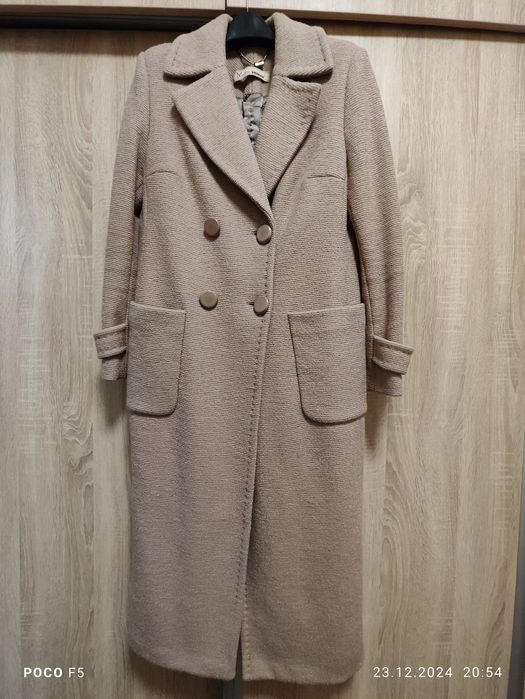Пальто фирмы Molto caldo