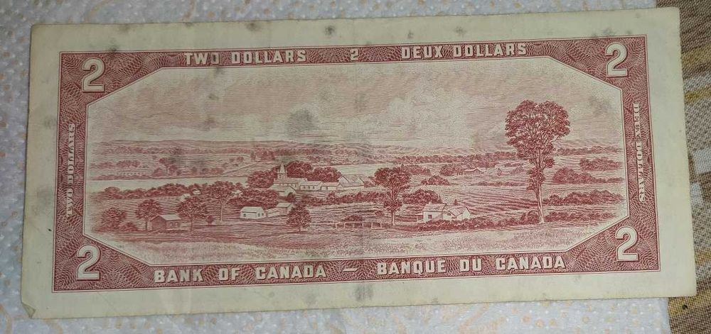 2 Канадски долара и 5 Брит.паунда