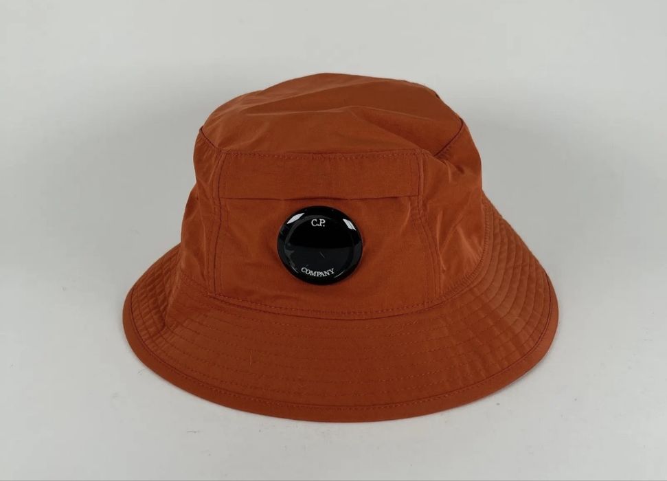 шушлякава шапка Cp company orange bucket.