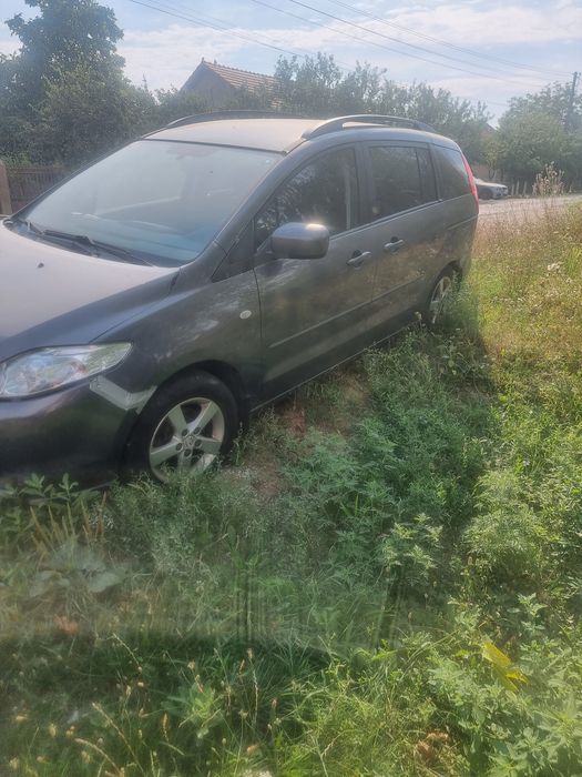 Vând mazda5.  7 locuri