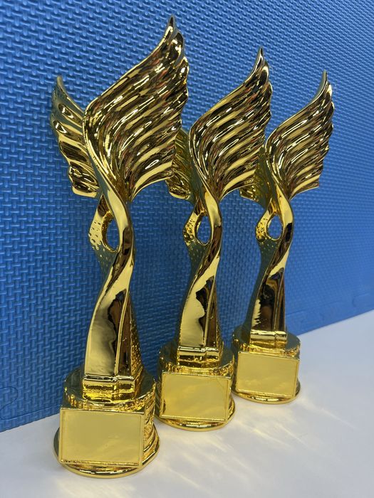 Статуэтки кубки медали награды