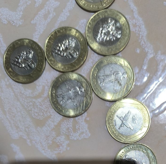 Манеты сто тенге