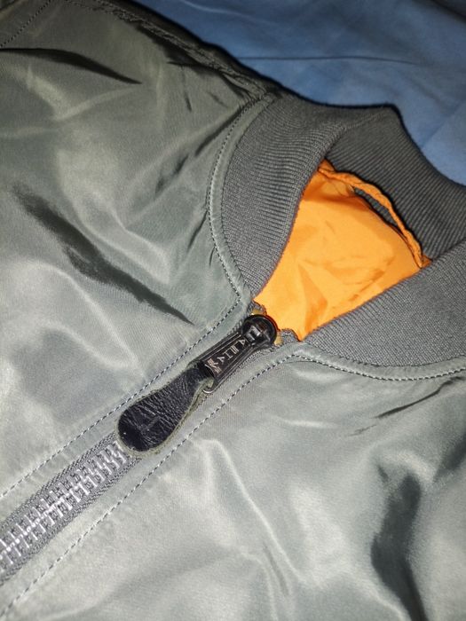 Alpha Industries MA-1 silver jacket.