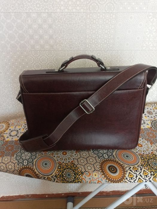 Продам мужской красивый портфель коричневого цвета,кожа,новый.