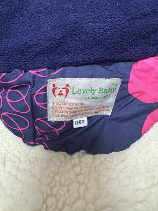 Продам зимний комбинезон для девочки 134 см