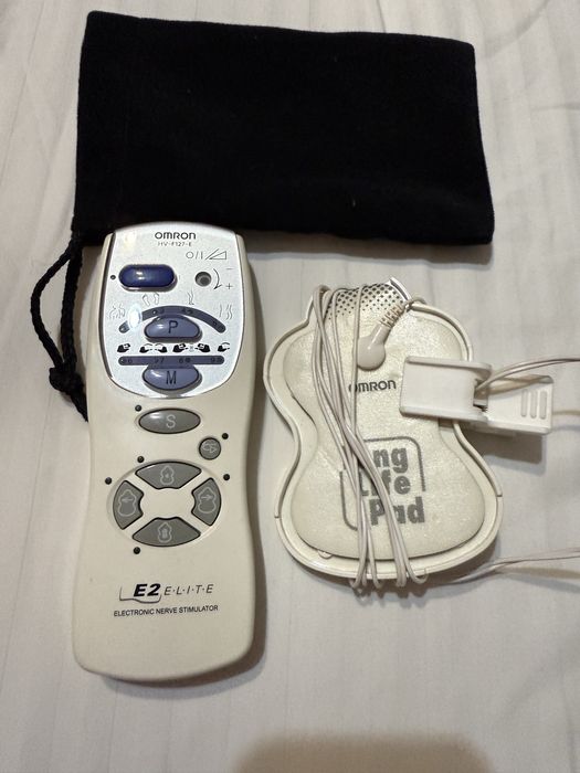 Электромассажер Omron снимает боль в ногах