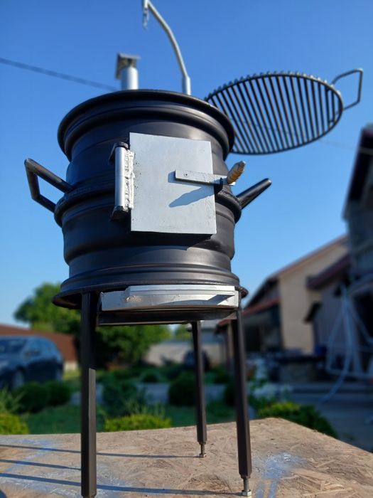 Gătește ca-n natură! Sobiță tip Godin cu grătar reglabil – 650 RON