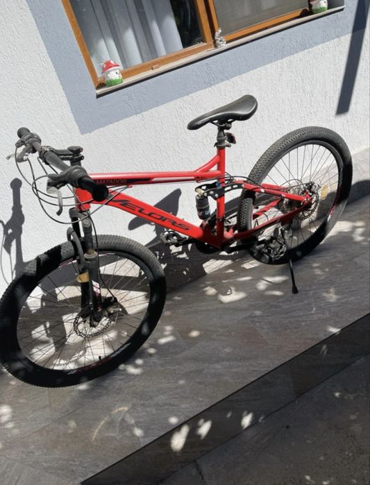 Bicicletă MTB DHS Matador roșie, cu suspensie