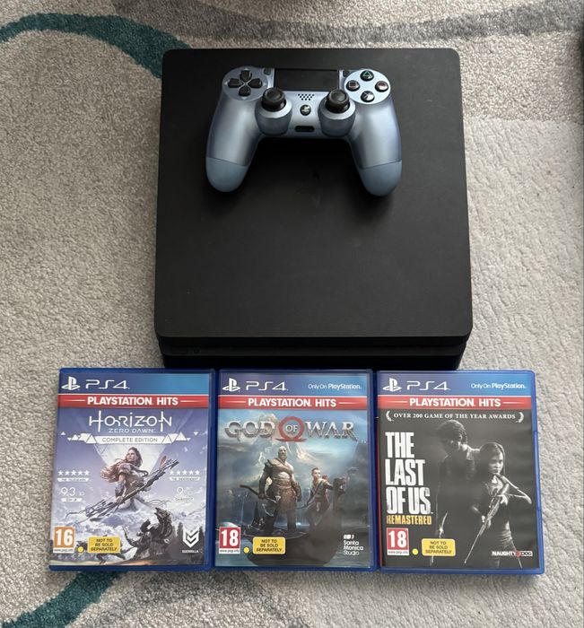 Playstation 4 slim with one controller and 3 games